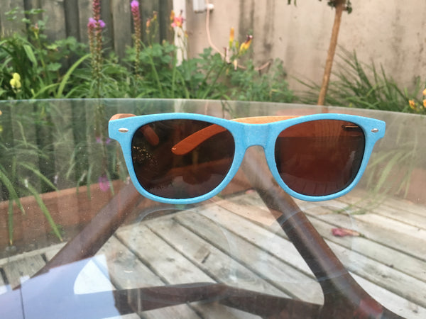 The Bowhead Wood Sunglasses - Happy Beluga - Wheat Straw Sunglasses outside